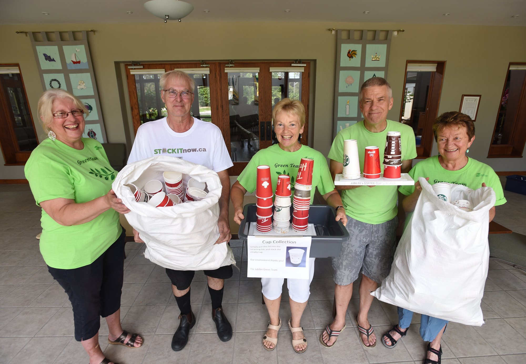 Jubilee United Church members Pat Lansche, left, Valerie Winters, Drew Winters and Judy Wells are working with North York-based Carbon Neutral Shredding owner Ian Chandler, white shirt, to dispose of recyclable coffee cups.